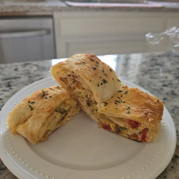 Stromboli halves on a white plate